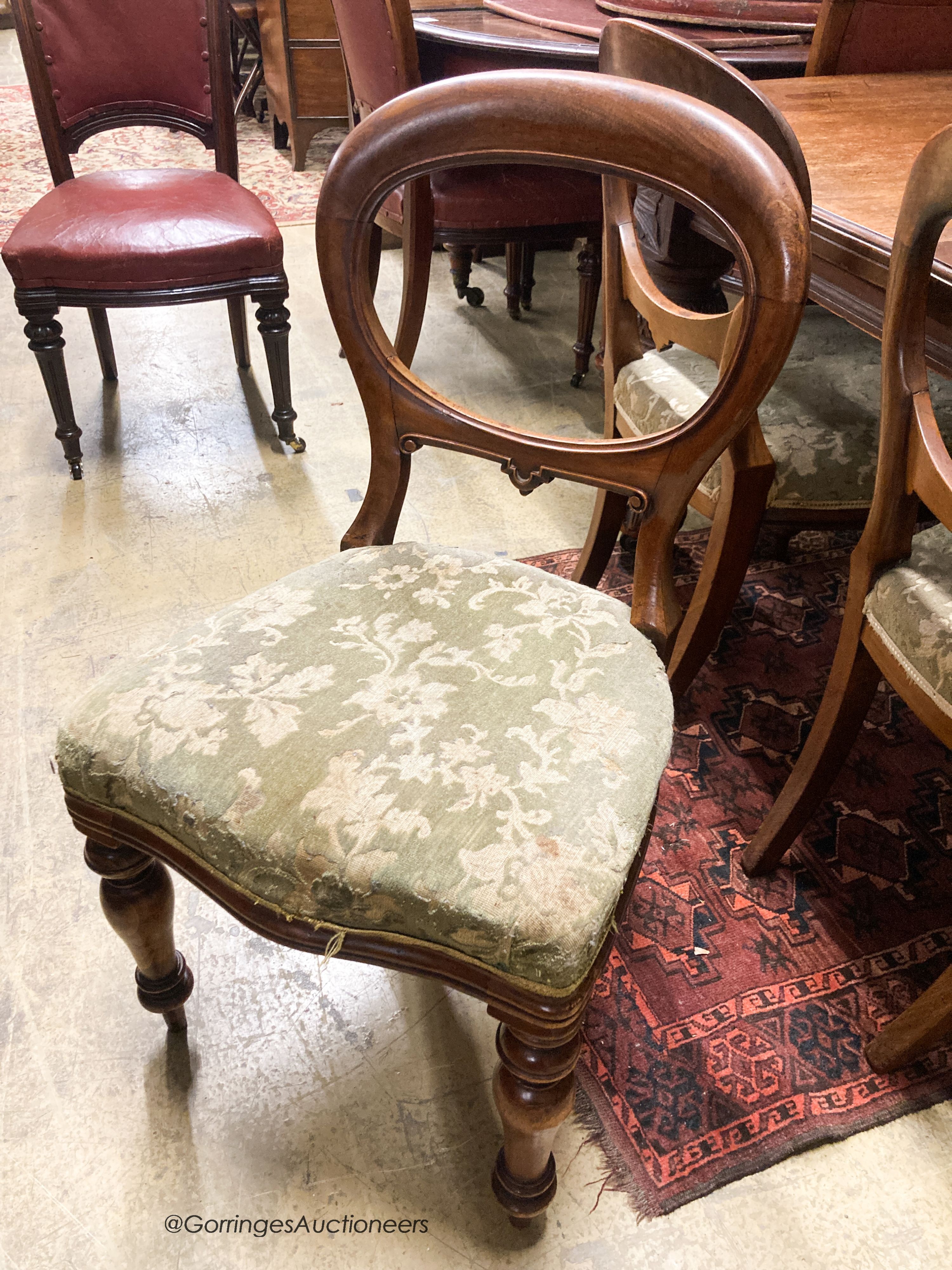 A late Victorian mahogany extending dining table, 238cm extended, two spare leaves, depth 118cm, height 72cm together with a set of eight Victorian mahogany balloon back dining chairs